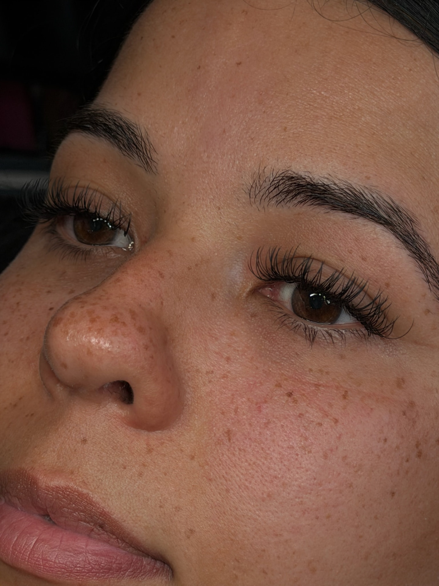 Close-up of volume lash extensions and shaped brows