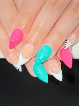 Pink, teal and white French-tip nails with sculpted accent details
