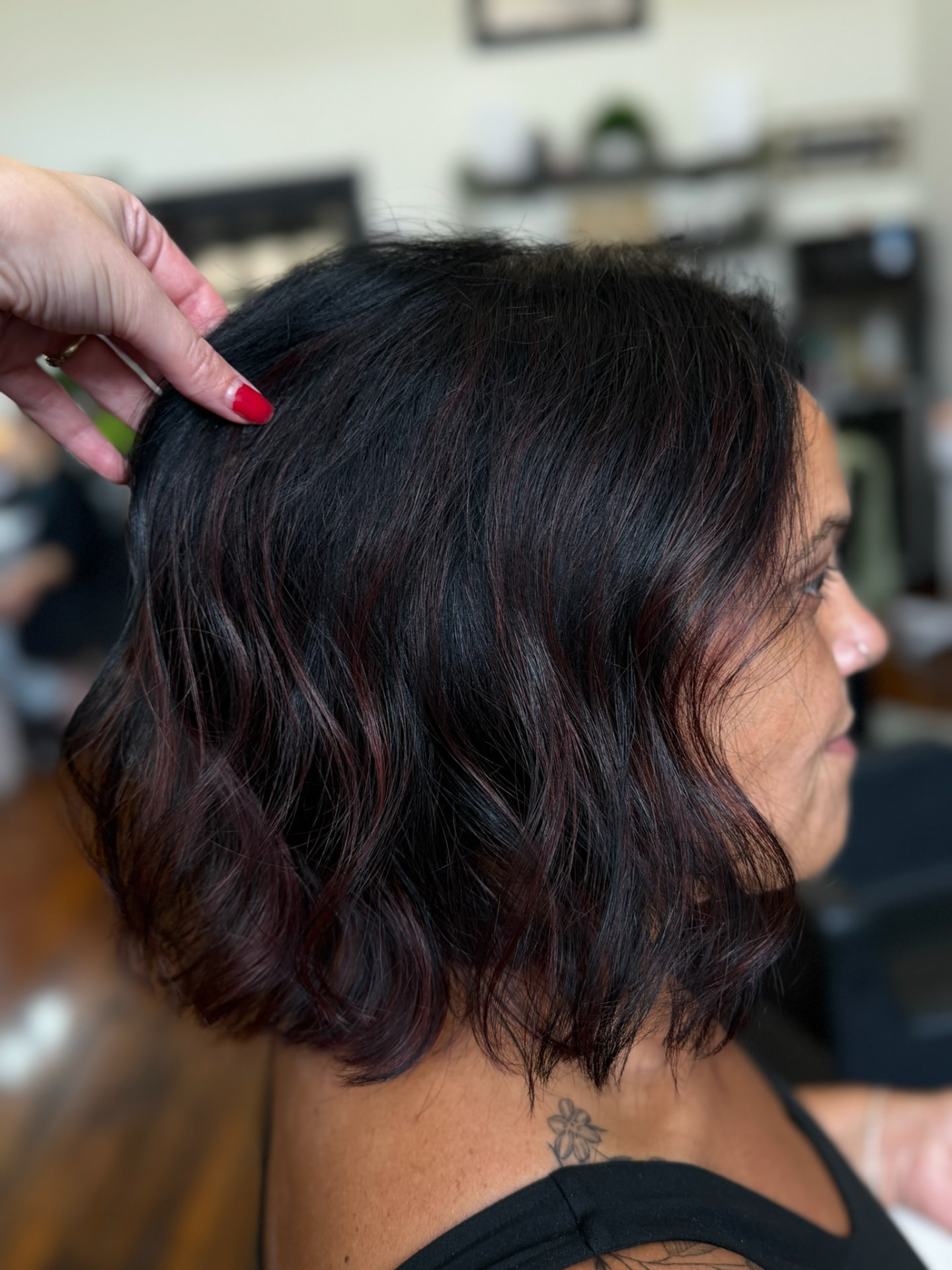 Wavy bob in black cherry with subtle red ribbons